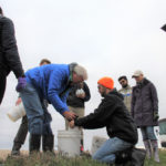 Don Flaten shows the students how to mix and package soil samples to be sent to the lab.