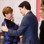 Marie-Claude Bibeau is embraced by Canada’s Prime Minister Justin Trudeau after being presented as minister of Agriculture and Agri-food during the presentation of Trudeau’s new cabinet, at Rideau Hall November 20.
