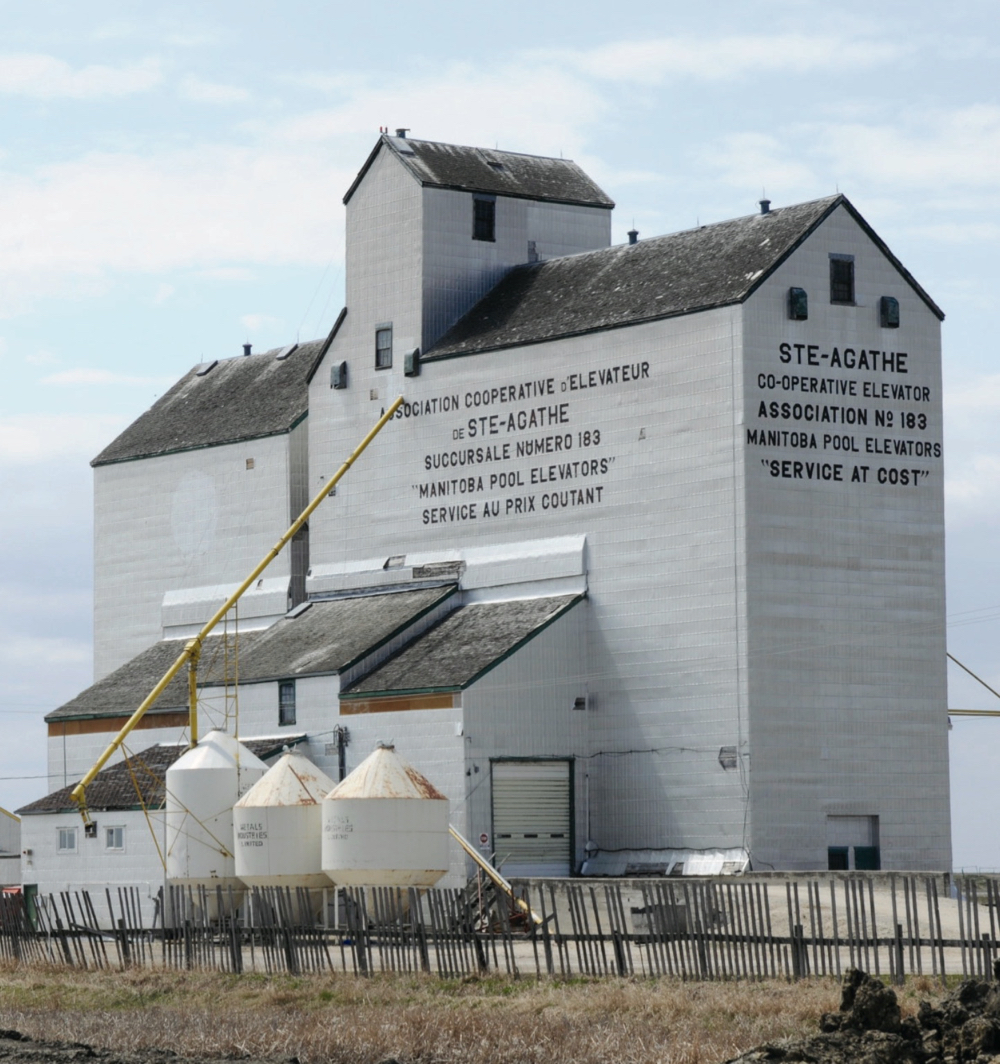 An elevator at Ste. Agathe was built around 1938 by La Cie Parent. Purchased by Manitoba Pool Elevators in 1945, its capacity was increased with crib annexes built in 1956 and 1962. Elevator and annexes were destroyed by fire on September 29, 1962 and rebuilt as a composite-style elevator later that year. Fully renovated in 1984, with an additional crib annex moved from Silver Plains, the facility operated until 2002 when it was closed by Agricore United and demolished in 2010.