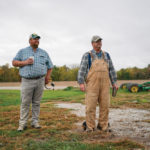 Paul Hodgen (l) and his father Abe stand on their farm in Roachdale, Indiana.