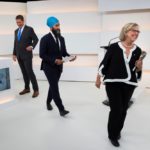Green Party leader Elizabeth May walks off the set past moderator Paul Wells (l), Conservative leader Andrew Scheer and New Democratic Party (NDP) leader Jagmeet Singh after the Maclean’s/Citytv leaders’ debate in Toronto on Sept. 12, 2019. (Pool photo: Frank Gunn via Reuters)
