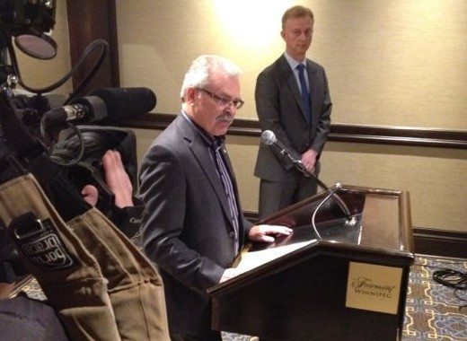 Agriculture Minister Gerry Ritz (with Pulse Canada CEO Gord Bacon at right) pledges expanded and more frequent reporting from the federal Grain Monitoring Program. (Dave Bedard photo)
