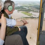 Prime Minister Stephen Harper (right) and Manitoba Premier Greg Selinger  survey flood damage in the Brandon area from the air on Sunday. (PMO photo by Jill Thompson)
