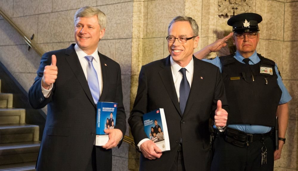 Prime Minister Stephen Harper and Finance Minister Joe Oliver head to the House of Commons to deliver Tuesday’s budget. (Deb Ransom photo courtesy PMO)
