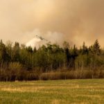 A CL-215 water bomber drops water on a fire north of Turtle Lake, Sask, on Thursday evening. (Lisa Guenther photo)