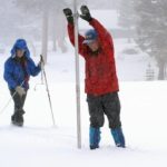 California’s Department of Water Resources gauges the snowpack in the Sierra Nevada mountains through manual surveys, such as this one in late December 2004. (Paul Hames photo, copyright California Department of Water Resources)
