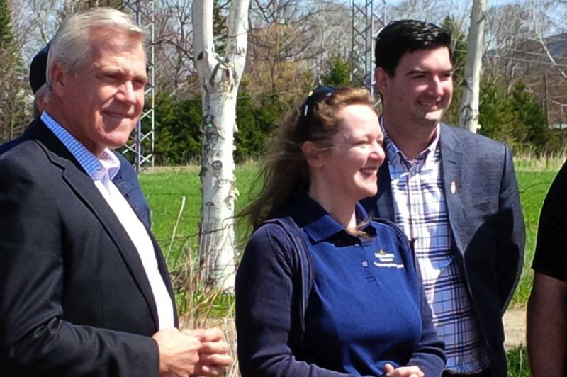 Premier Dwight Ball, provincial grain research specialist Dr. Vanessa Kavanagh and Christopher Mitchelmore, minister for the Forestry and Agrifoods Agency, watch the seeding of Newfoundland and Labrador’s first canola field. (Gov.nl.ca)
