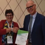 Erwin Northoff (r), chief of media for FAO, presents the Star Prize to Laura Rance at the 2016 IFAJ Congress in Bonn, Germany. (IFAJ.org)