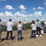 Julian Heath, research operations lead at the newly expanded Saskatoon facility, explains the Saskatoon plots to open-house guests. (Leeann Minogue photo)
