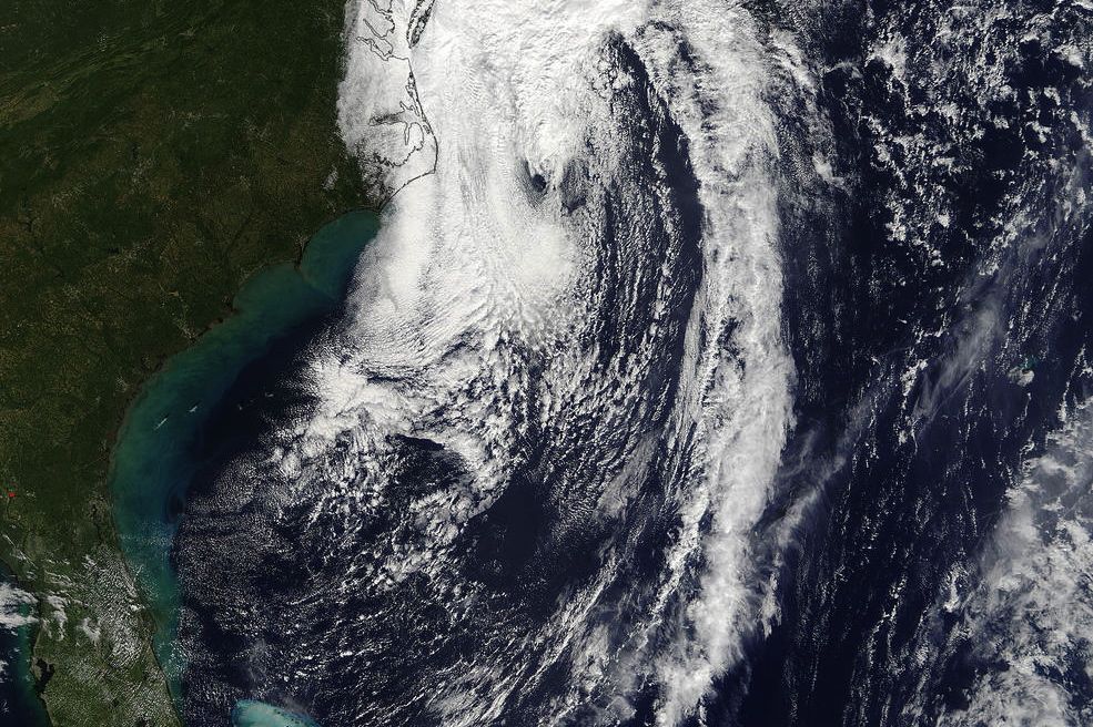 NASA’s Terra satellite observes Post-Tropical Cyclone Matthew being absorbed by a cold front along the U.S. Eastern Seaboard on Oct. 9 at 11:45 a.m. ET. (NASA Goddard MODIS Rapid Response Team)
