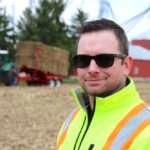Dave Park, Sarnia-area farmer and president of the Cellulosic Sugar Producers Co-operative stands in front of one of the bale accumulators that will be used by the co-op.  Photo: John Greig
