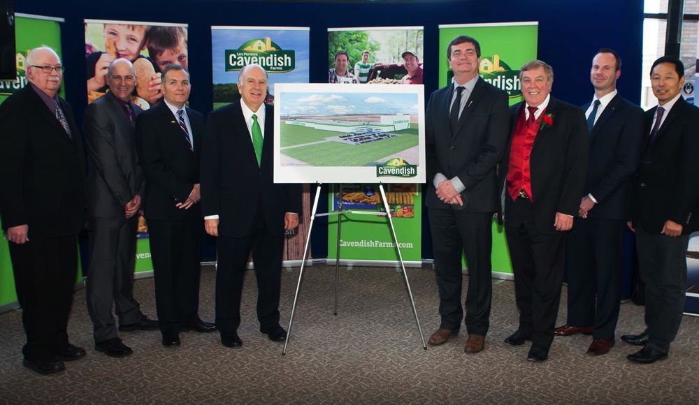 Unveiling a rendering of Cavendish Farms’ planned new Lethbridge plant (close-up below) are (l-r) 48-year Cavendish employee Gerry Patterson; Cavendish’s Lethbridge director of operations, Lee Gleim; Cavendish’s senior vice-president Ron Clow, Cavendish president Robert Irving; Alberta Agriculture Minister Oneil Carlier; Lethbridge Mayor Chris Spearman; Trevor Lewington, CEO of Economic Development Lethbridge; and potato grower Greg Nakamura. (Photo and graphic courtesy Cavendish Farms)
