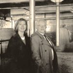 Animal science professor Red Williams, shown here in 2000 touring the old University of Saskatchewan barn with University of Wyoming research scientist Mary Humstone, died March 26 at age 93. (Usask.ca)