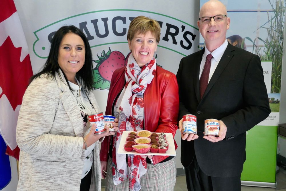 Marie-Claude Bibeau (centre), shown here Feb. 11 announcing federal funding for a Smucker’s Foods dairy plant at Sherbrooke, Que., is Canada’s new agriculture minister. (MCBibeau.Liberal.ca)
