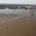 A section of road is underwater stranding a vehicle after flooding near Waterloo, Neb. on March 18, 2019. (Handout photo by Ryan Hignight/U.S. Army Corps of Engineers, Omaha District, via Reuters)
