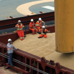 Employees at the Tiplam terminal in Santos, Brazil load soybeans on a cargo ship bound for China on March 13, 2017.