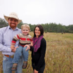 Thomas and Felicity Hagan and family pose on their cow-calf and grass-fed beef operation near Oak Lake.