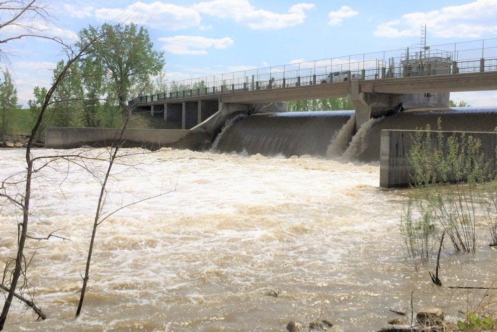 Spring runoff flows through a control structure on the Assiniboine River near Portage la Prairie, Man. in 2014. (MarketsFarm photo by Glen Hallick)
