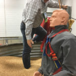 Turn on the six-inch auger under this bin and the demonstration mannequin will be chest deep in grain in just eight or nine seconds.