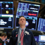 A trader works on the floor of the New York Stock Exchange (NYSE) shortly after the opening of trading in New York on March 13.