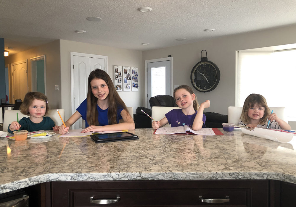 Janssens girls Maddie (3), Kaity (10), Lexi (6) and Hailey (3) do home work at their Boissevain-area home.