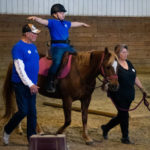 Each riding student has a support team of three volunteers.