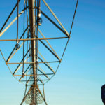 Farmer Ian Shippen stands under a mobile irrigation boom stretching nearly half a kilometre on his farm in the heart of Australia’s Murray-Darling River basin.