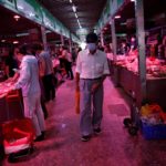 A customer shops at a pork meat hall at the Yuegezhuang wholesale market in Beijing on June 17, 2020. (Photo: Reuters/Tingshu Wang)