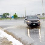 Floodwaters claim the main road access to the Brandon Municipal Airport June 29.