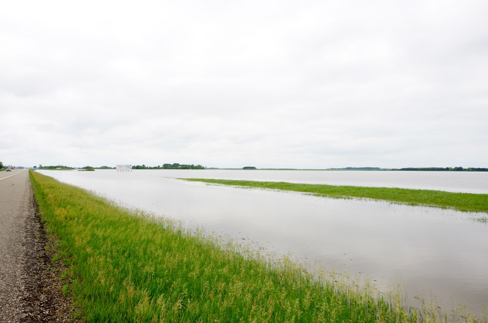 A temporary lake overtakes the landscape north of Brandon June 29 following torrential rain and widespread overland flooding.
