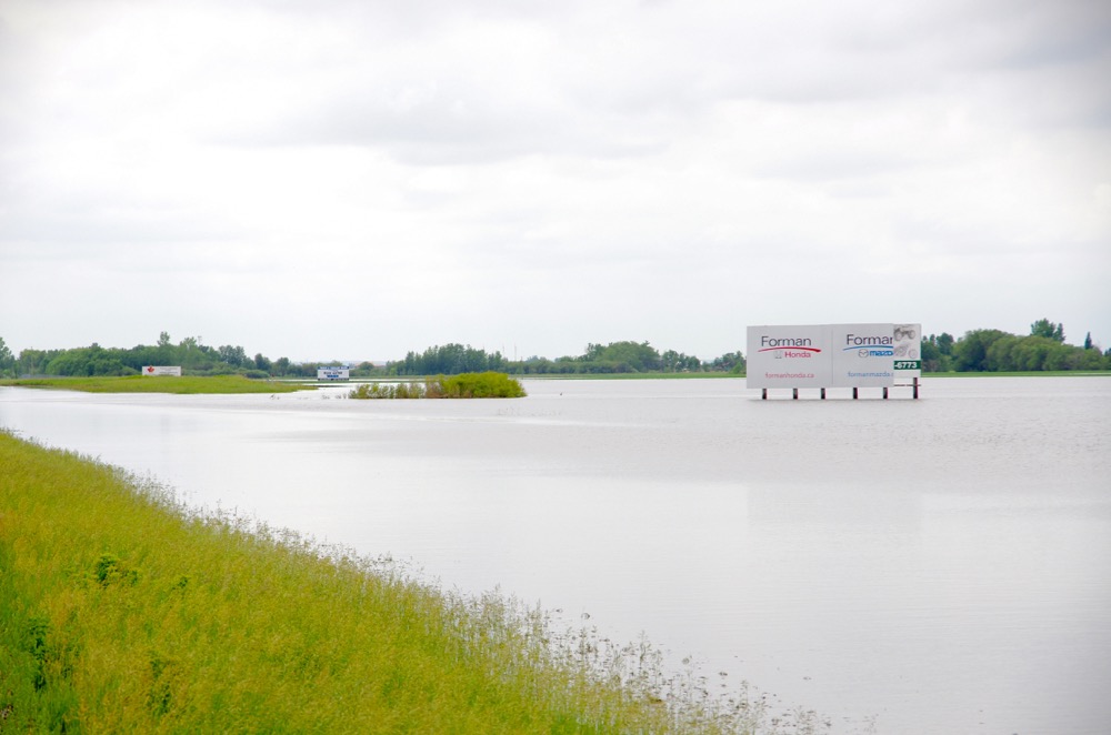 A temporary lake overtakes the landscape north of Brandon June 29 following torrential rain and widespread overland flooding.