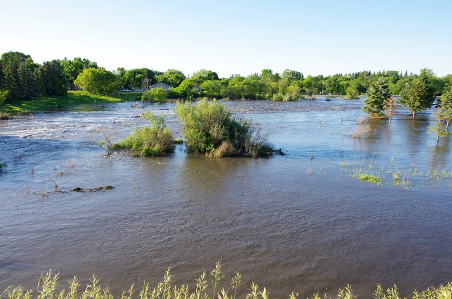 Neepawa's green space north of Highway 16 fills with flood water July 1 after one out of a string of storms to cause flooding across western Manitoba. 