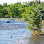 Neepawa's green space north of Highway 16 fills with flood water July 1 after one out of a string of storms to cause flooding across western Manitoba. 