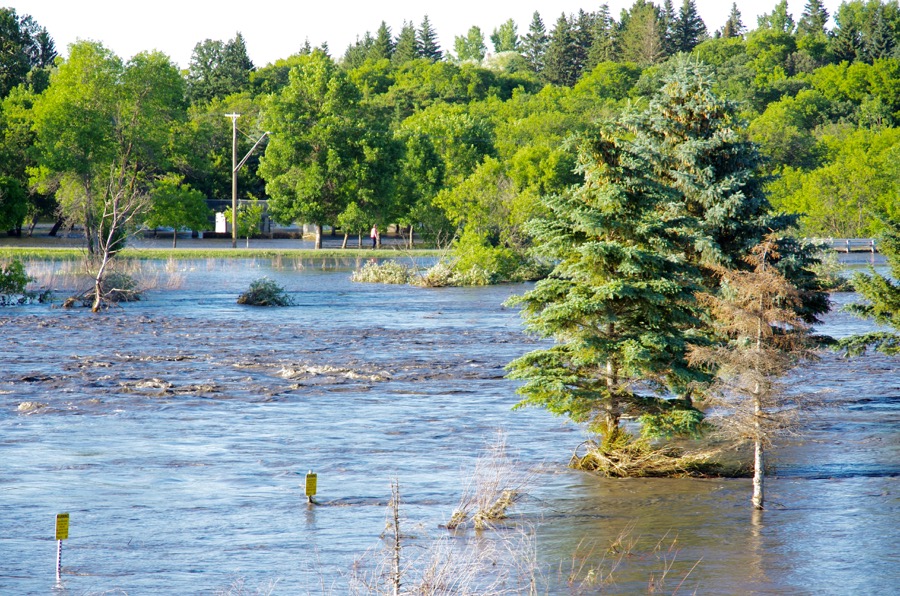 Neepawa's green space north of Highway 16 fills with flood water July 1 after one out of a string of storms to cause flooding across western Manitoba. 