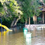 The Little Saskatchewan River spills its banks through the Town of Minnedosa July 1, flooding a local park.