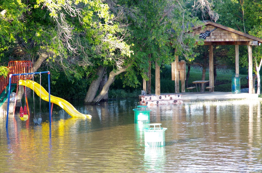 The Little Saskatchewan River spills its banks through the Town of Minnedosa July 1, flooding a local park.