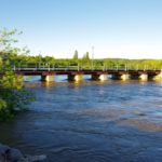 The Little Saskatchewan River creeps up toward a rail bridge in the Town of Minnedosa July 1, the day after flooding caused evacuations in the town.