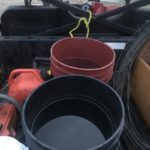 Empty buckets left out overnight June 28 display the scale of rainfall near Rivers during the first of what would end up being a string of storms into the first week of July. 