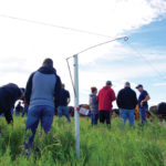 Ted Unruh demonstrates his automatic fence lifter, which takes the place of a conventional gate.