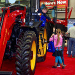 Kids explore farm machinery on display at Manitoba Ag Days 2020.