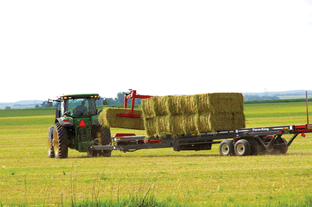 A producer in west-central Manitoba moves bales earlier this year.