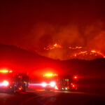 Los Angeles County firefighters patrol the front fire lines Friday night from the Bobcat Fire near Juniper Hills, California on Sept. 18, 2020.