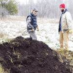 Mike and son Sky harvesting finished castings from a ridge row of manure.