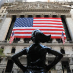 The Fearless Girl statue is seen outside the New York Stock Exchange (NYSE) on election day in Manhattan, New York City.