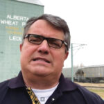 Stan Blade at a grain elevator in Leduc, Alta., discussing the future of logistics in agriculture.