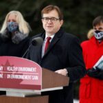 Environment Minister Jonathan Wilkinson, with Infrastructure Minister Catherine McKenna (l) and Heritage Minister Steven Guilbeault (r), speaks at the Dominion Arboretum in Ottawa on Dec. 11, 2020. (Photo: Reuters/Blair Gable)