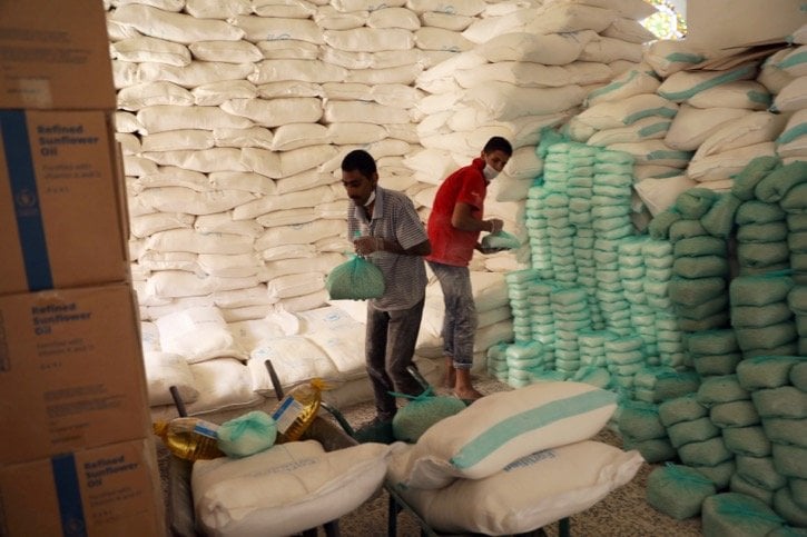 Workers prepare foodstuffs at a food distribution centre supported by the World Food Program at Sanaa, Yemen’s capital, on June 3, 2020. File photo: Reuters/Khaled Abdullah

