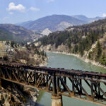 The charred remnants of the rail bridge, destroyed by a wildfire on June 30, is seen during a media tour by authorities in Lytton, British Columbia, July 9, 2021.
