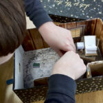 Decker Colony student works on a shoebox diorama.