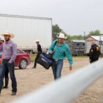 Riders arrive at the arena for the contest.